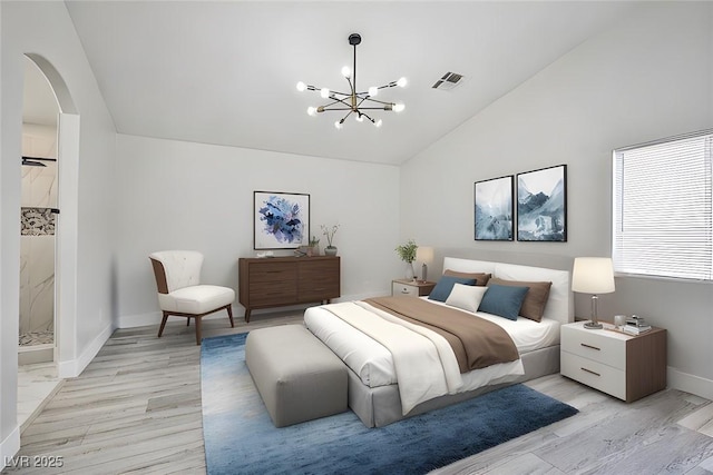 1002 Christopher View Ave, North Las Vegas, NV 89032 - bedroom featuring lofted ceiling, arched walkways, light wood-style flooring, and a chandelier