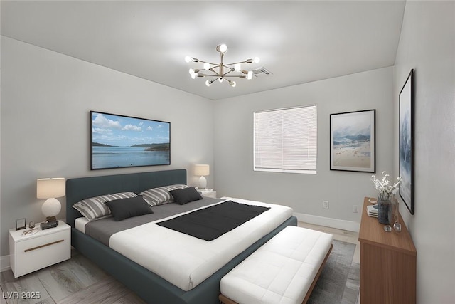 1002 Christopher View Ave, North Las Vegas, NV 89032 - bedroom with a chandelier and light wood-style floors