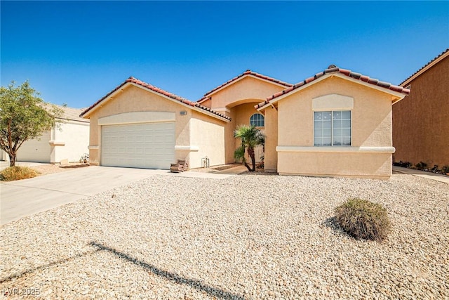 1002 Christopher View Ave, North Las Vegas, NV 89032 - mediterranean / spanish-style house featuring stucco siding, a garage, driveway, and a tile roof