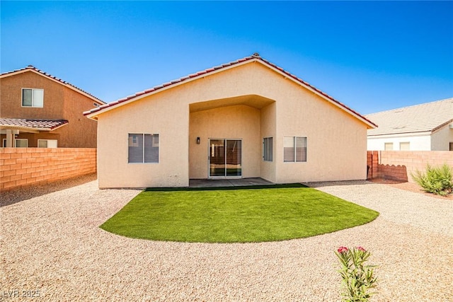 1002 Christopher View Ave, North Las Vegas, NV 89032 - rear view of house with a fenced backyard, stucco siding, and a patio