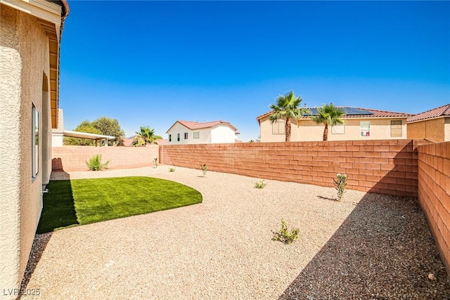 1002 Christopher View Ave, North Las Vegas, NV 89032 - fenced backyard with a patio area