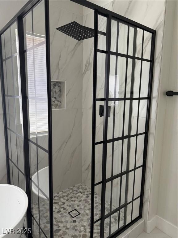 1002 Christopher View Ave, North Las Vegas, NV 89032 - bathroom featuring a marble finish shower and a freestanding bath