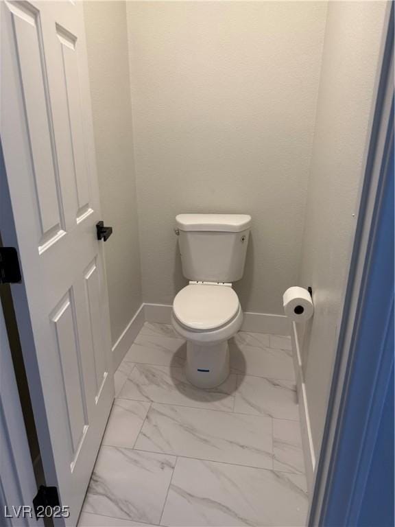 1002 Christopher View Ave, North Las Vegas, NV 89032 - bathroom featuring baseboards and marble finish floors