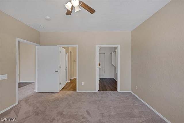 4625 Centisimo Dr Unit 202, North Las Vegas, NV 89084 - unfurnished bedroom featuring carpet, a spacious closet, and ceiling fan