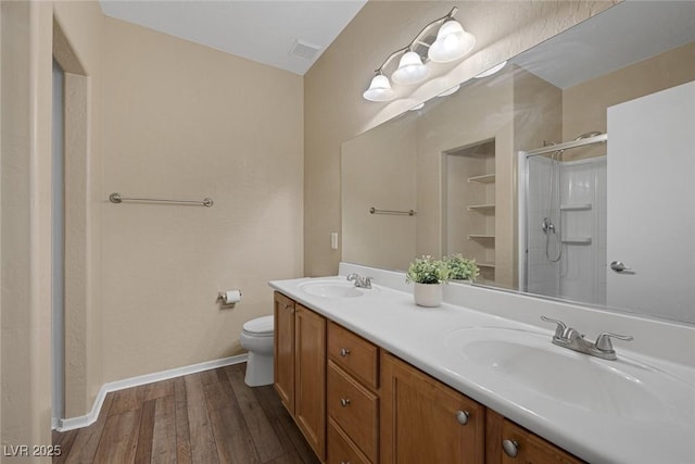 4625 Centisimo Dr Unit 202, North Las Vegas, NV 89084 - full bathroom featuring double vanity, wood finished floors, and a shower stall