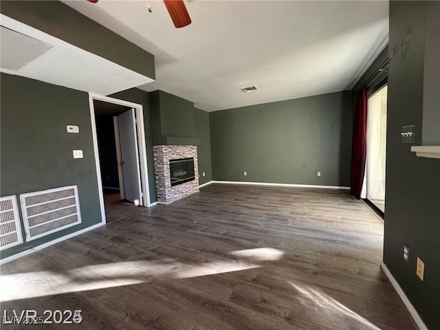 4855 S Torrey Pines Dr Unit 201, Las Vegas, NV 89103 - unfurnished living room with ceiling fan, a fireplace, and dark wood-type flooring