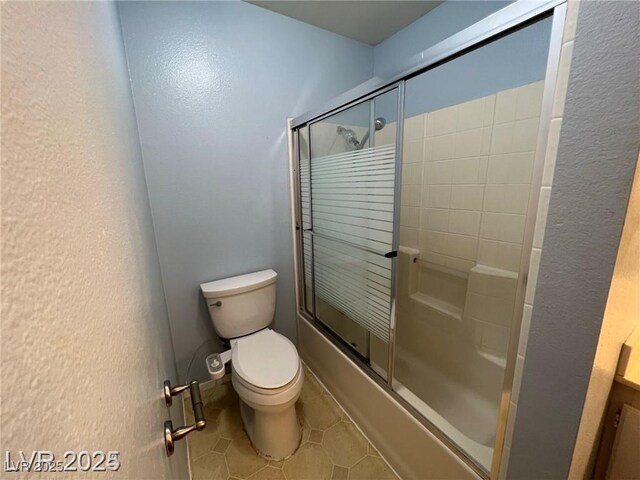 4855 S Torrey Pines Dr Unit 201, Las Vegas, NV 89103 - bathroom with bath / shower combo with glass door and tile patterned flooring