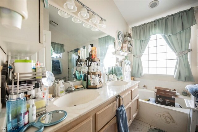 3648 Glen Ridge Way, Las Vegas, NV 89108 - bathroom with a garden tub and double vanity