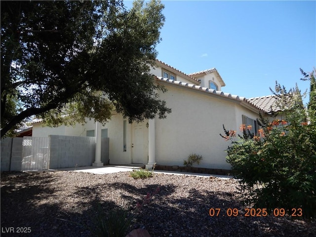 3428 Strawberry Roan Rd, North Las Vegas, NV 89032 - back of property featuring stucco siding and a tiled roof
