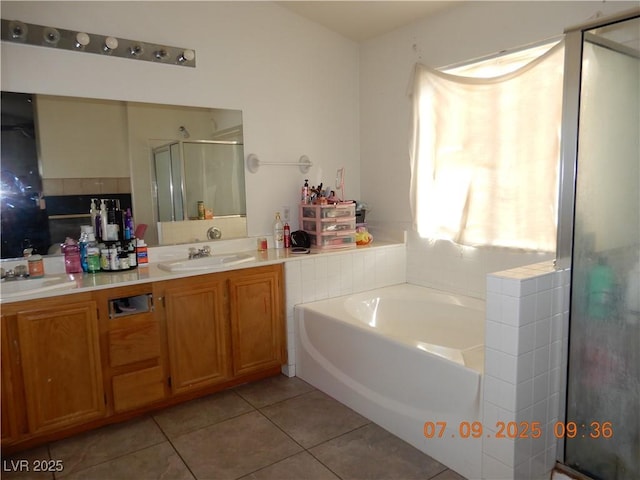 3428 Strawberry Roan Rd, North Las Vegas, NV 89032 - full bath featuring tile patterned floors, a shower stall, a garden tub, and double vanity