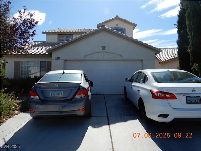 3428 Strawberry Roan Rd, North Las Vegas, NV 89032 - mediterranean / spanish-style home featuring a tiled roof, an attached garage, stucco siding, and concrete driveway