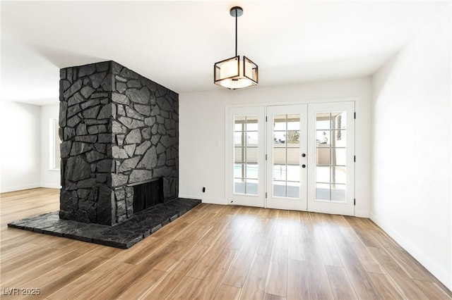 4135 E Harmon Ave, Las Vegas, NV 89121 - unfurnished living room featuring wood finished floors