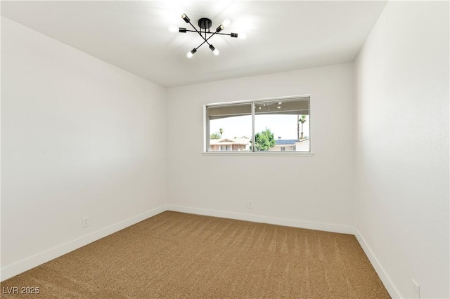 4135 E Harmon Ave, Las Vegas, NV 89121 - unfurnished room featuring light carpet and a chandelier