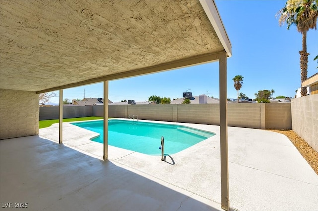 4135 E Harmon Ave, Las Vegas, NV 89121 - view of swimming pool featuring a patio area and a fenced backyard