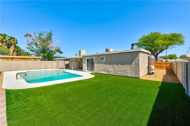 4135 E Harmon Ave, Las Vegas, NV 89121 - back of house featuring a fenced backyard, stucco siding, and a patio