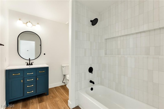4135 E Harmon Ave, Las Vegas, NV 89121 - bathroom with vanity, wood finished floors, and tub / shower combination