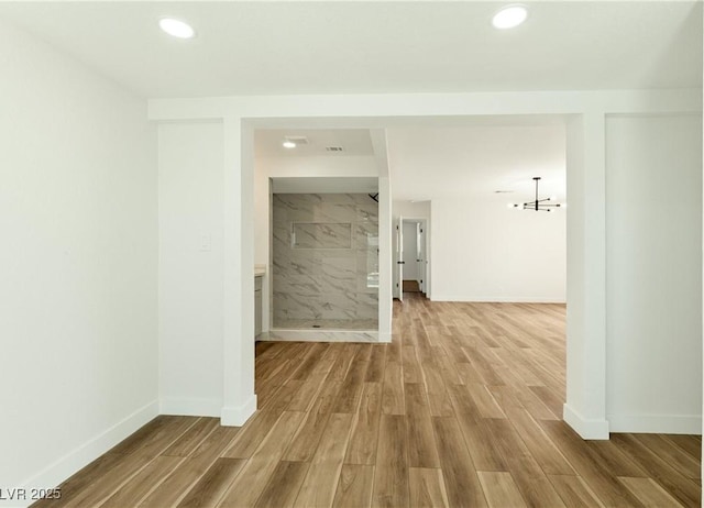 4135 E Harmon Ave, Las Vegas, NV 89121 - hall featuring wood finished floors and recessed lighting