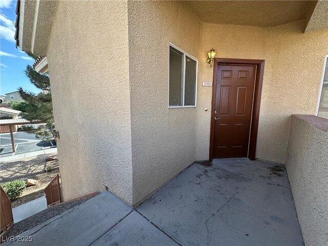1050 E Cactus Ave Unit 2086, Las Vegas, NV 89183 - view of exterior entry with stucco siding