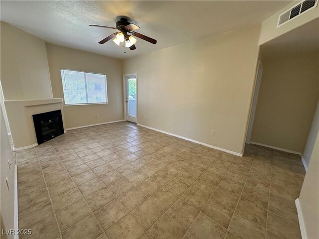 1050 E Cactus Ave Unit 2086, Las Vegas, NV 89183 - unfurnished living room with a ceiling fan and a fireplace