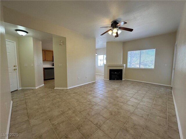 1050 E Cactus Ave Unit 2086, Las Vegas, NV 89183 - unfurnished living room featuring a ceiling fan, a fireplace, and light tile patterned floors