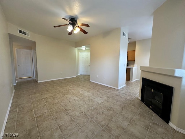 1050 E Cactus Ave Unit 2086, Las Vegas, NV 89183 - unfurnished living room featuring ceiling fan and a glass covered fireplace