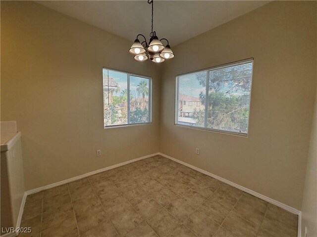 1050 E Cactus Ave Unit 2086, Las Vegas, NV 89183 - unfurnished room with a chandelier and baseboards
