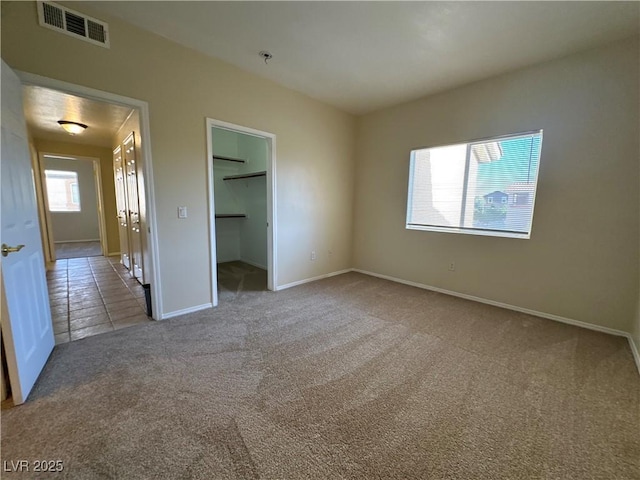 1050 E Cactus Ave Unit 2086, Las Vegas, NV 89183 - unfurnished bedroom with carpet floors and a walk in closet