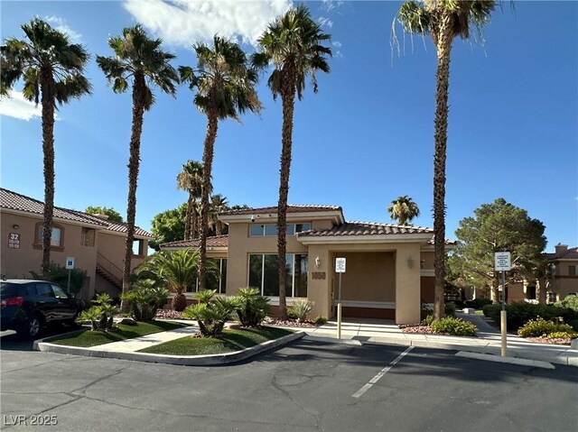 1050 E Cactus Ave Unit 2086, Las Vegas, NV 89183 - view of front of property with stucco siding and a tiled roof