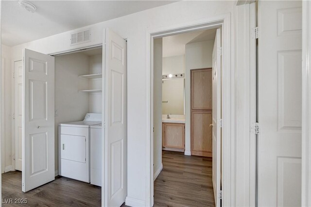 1050 E Cactus Ave Unit 2110, Las Vegas, NV 89183 - washroom with dark wood-style flooring and independent washer and dryer