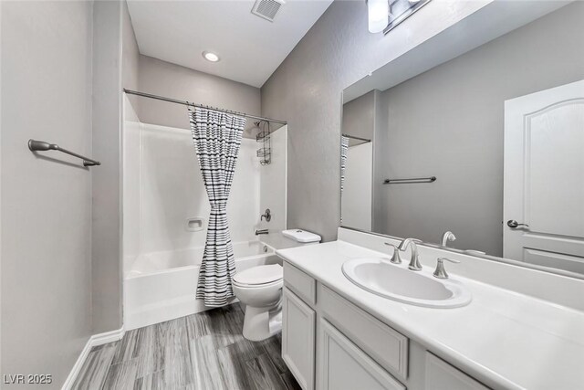 12313 Old Muirfield St, Las Vegas, NV 89141 - bathroom with vanity, shower / tub combo with curtain, and wood finished floors
