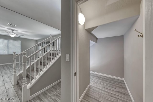 12313 Old Muirfield St, Las Vegas, NV 89141 - stairway with ceiling fan and wood finished floors