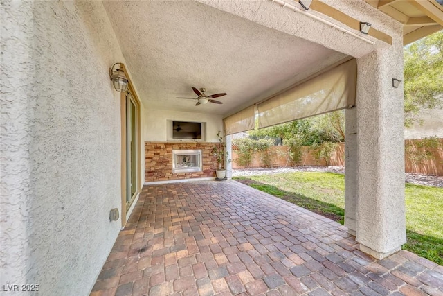 12313 Old Muirfield St, Las Vegas, NV 89141 - fenced backyard featuring ceiling fan and a patio area