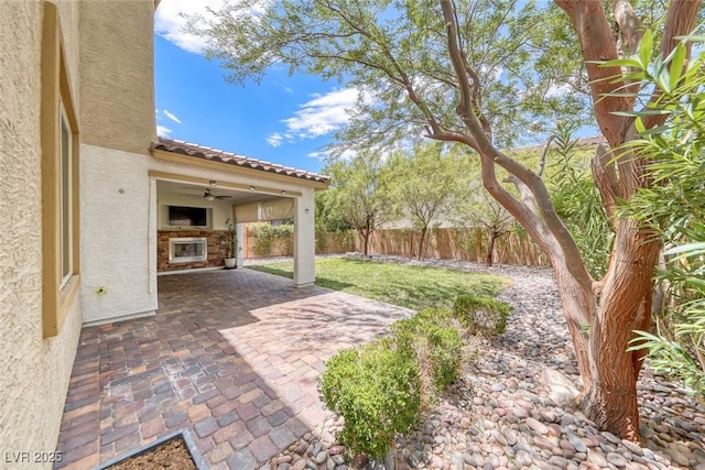 12313 Old Muirfield St, Las Vegas, NV 89141 - fenced backyard featuring a patio area and ceiling fan