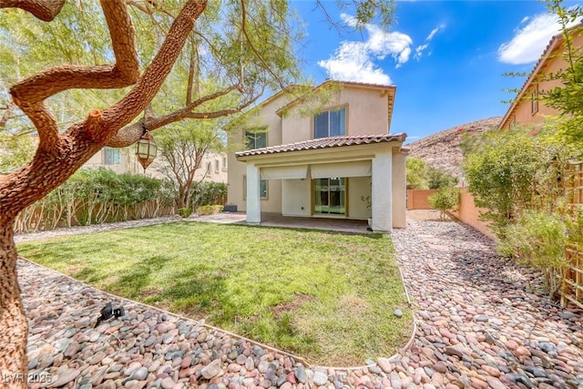 12313 Old Muirfield St, Las Vegas, NV 89141 - back of property with stucco siding, a patio, a fenced backyard, and a tiled roof