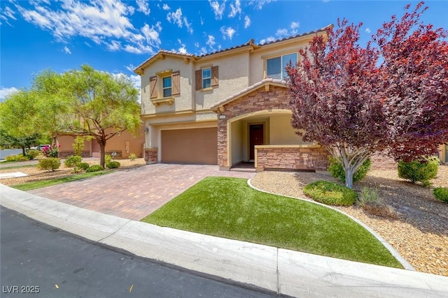 12313 Old Muirfield St, Las Vegas, NV 89141 - mediterranean / spanish-style home with stone siding, stucco siding, a garage, and decorative driveway