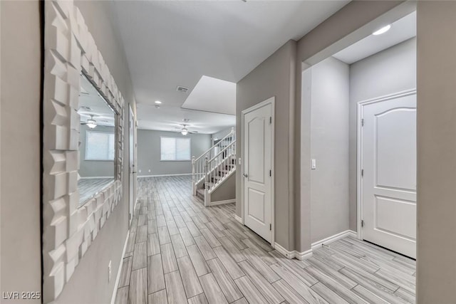 12313 Old Muirfield St, Las Vegas, NV 89141 - hallway with light wood-style floors and stairway