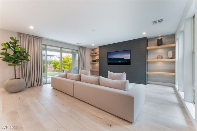 10280 Midnight Meteor Ave, Las Vegas, NV 89166 - living room with light wood-style flooring and recessed lighting