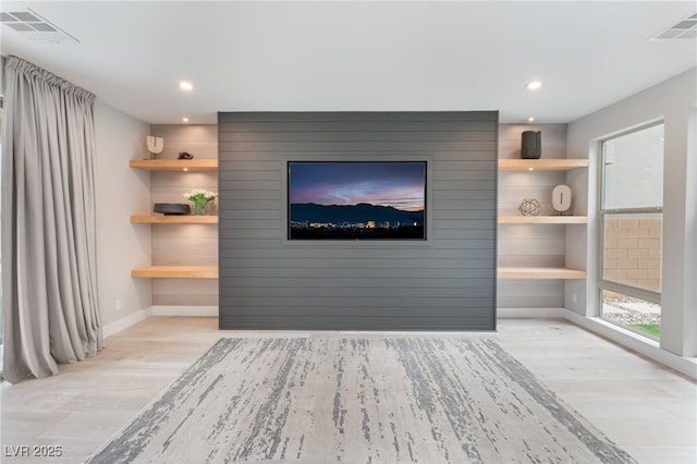 10280 Midnight Meteor Ave, Las Vegas, NV 89166 - unfurnished living room featuring wood finished floors and recessed lighting