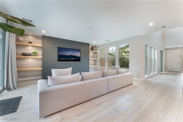 10280 Midnight Meteor Ave, Las Vegas, NV 89166 - living room featuring light wood-type flooring, recessed lighting, and built in features