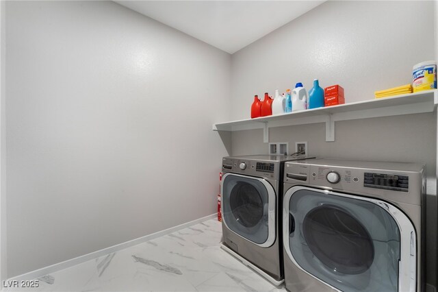 10280 Midnight Meteor Ave, Las Vegas, NV 89166 - laundry area with washer and dryer and light marble finish flooring