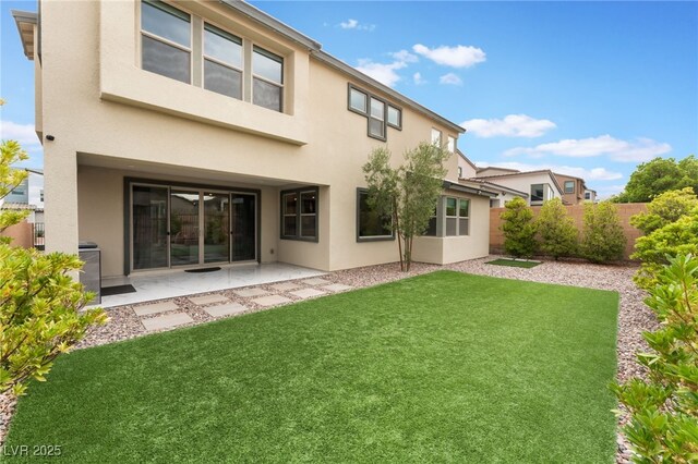 10280 Midnight Meteor Ave, Las Vegas, NV 89166 - back of house with stucco siding and a patio