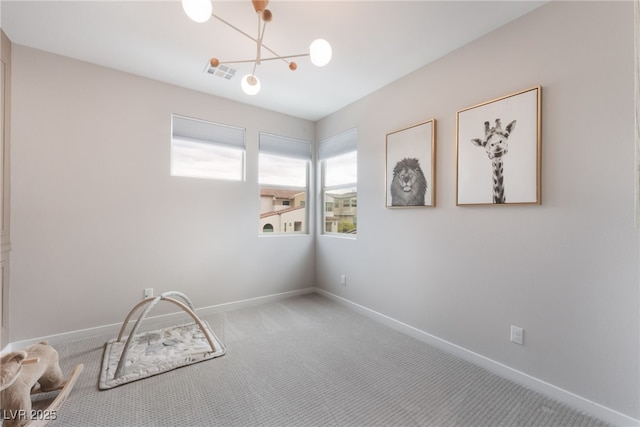 10280 Midnight Meteor Ave, Las Vegas, NV 89166 - unfurnished room with carpet floors and a chandelier