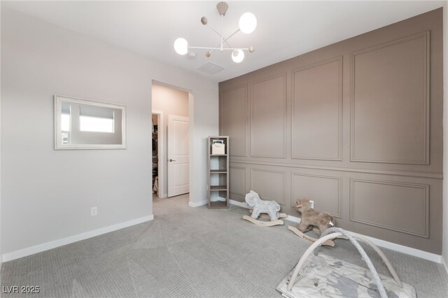 10280 Midnight Meteor Ave, Las Vegas, NV 89166 - unfurnished bedroom with light colored carpet and a chandelier