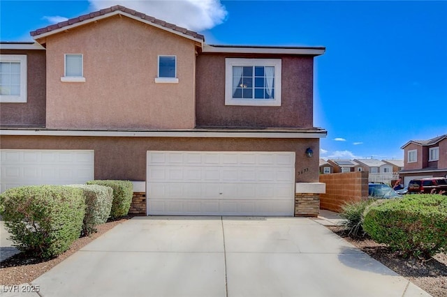 3673 Calypso Beach Ct, Las Vegas, NV 89115 - view of property with an attached garage, stucco siding, and concrete driveway