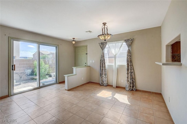 3673 Calypso Beach Ct, Las Vegas, NV 89115 - unfurnished dining area with plenty of natural light and light tile patterned floors