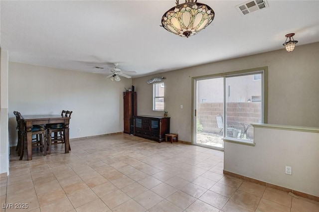 3673 Calypso Beach Ct, Las Vegas, NV 89115 - living room featuring a ceiling fan and light tile patterned floors