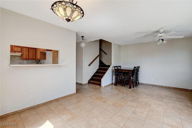 3673 Calypso Beach Ct, Las Vegas, NV 89115 - living room featuring stairs, ceiling fan, and light tile patterned flooring