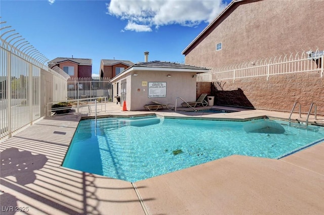 3673 Calypso Beach Ct, Las Vegas, NV 89115 - community pool with a patio area