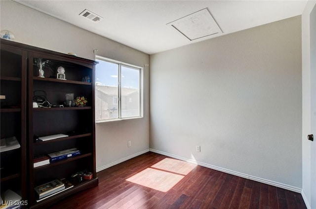 3673 Calypso Beach Ct, Las Vegas, NV 89115 - spare room featuring wood finished floors and attic access