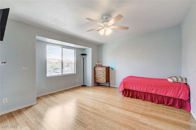 3673 Calypso Beach Ct, Las Vegas, NV 89115 - bedroom with wood finished floors and a ceiling fan